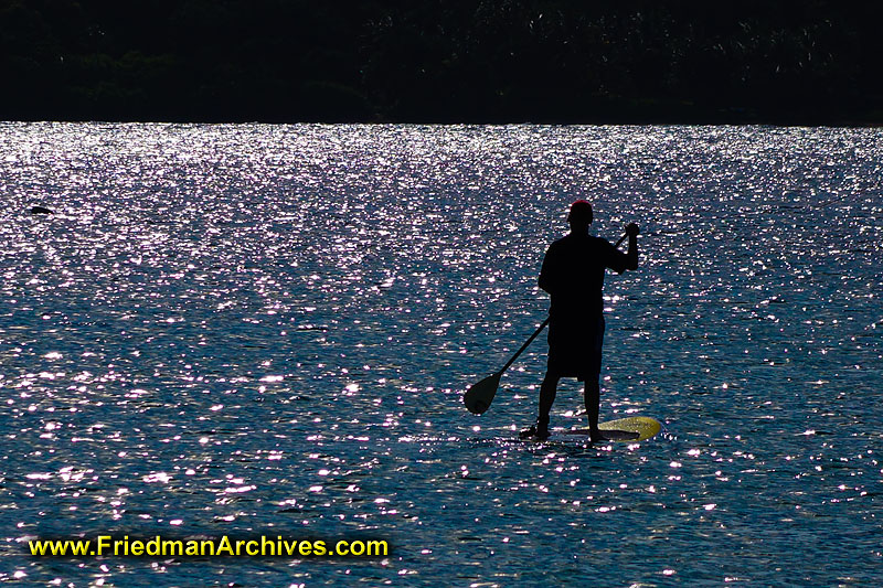 beach,hawaii,kauai,surfing,paddle board,paddleboard,water,ocean,travel,sports,vacation,holiday,silhouette,oar,man,